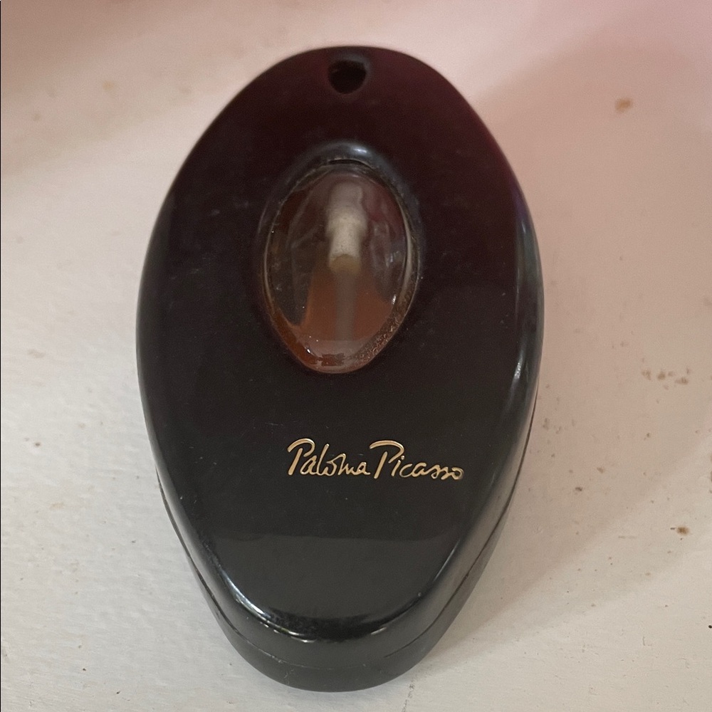 Vtg Paloma Picasso Eau de Parfum. Black and Gold Perfume Bottle. Half+ full.